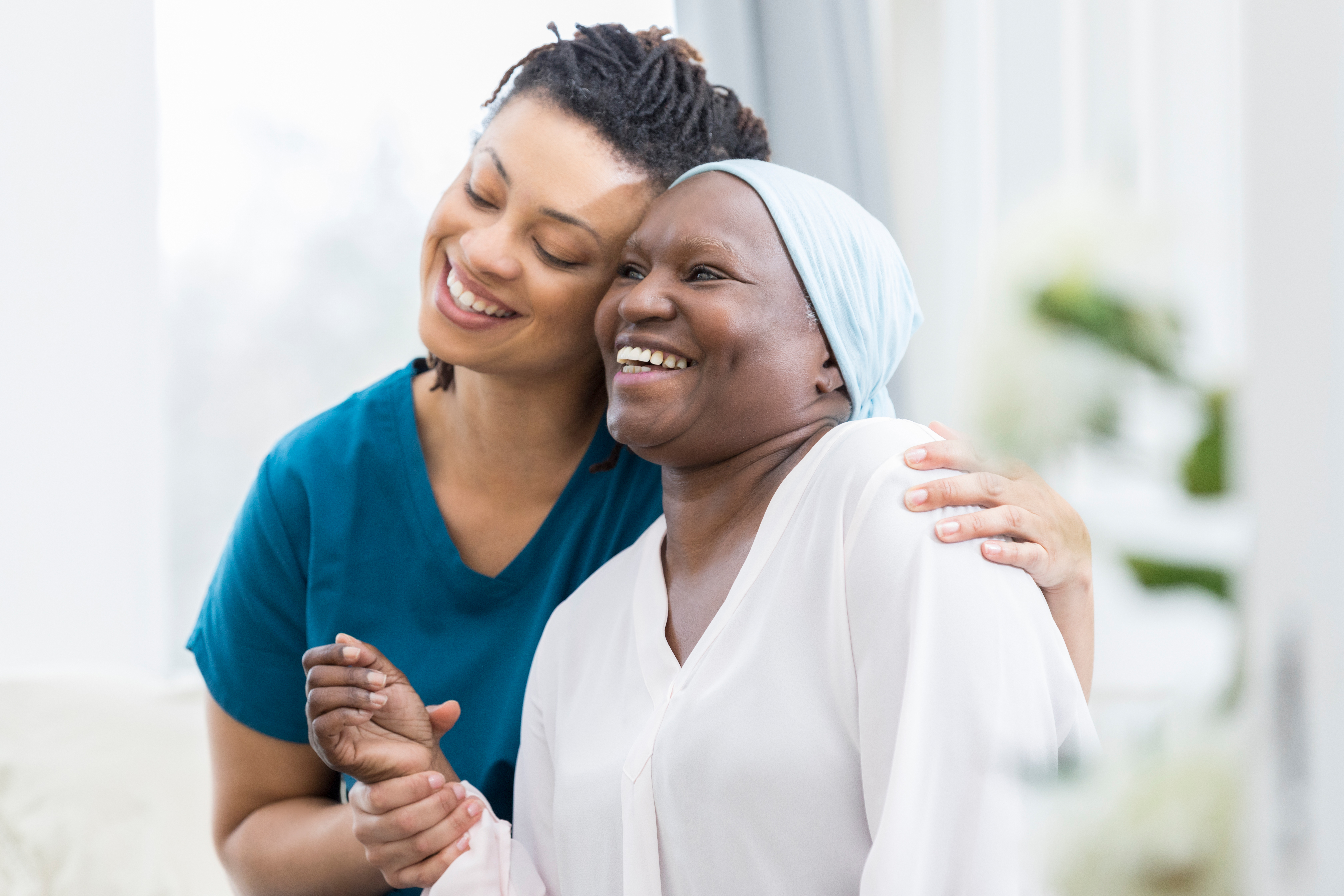 Mid adult woman visits her elderly mother